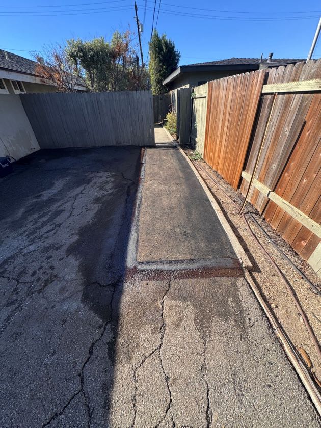 After: new asphalt along the same walkway in Costa Mesa